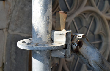 Detail of Steel Scaffolding Joint & Pole beside Old Church Window 