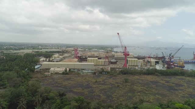 Aerial view of shipyard with ships in docks, cranes and warehouses. Batangas Shipyard, Philippines, Luzon.