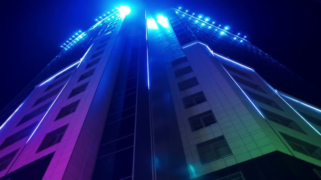 movement of colored neon lines in the building of the business center 4k