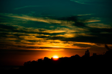 Blue and yellow background with sunset sun