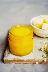 Homemade Ghee / Clarified butter in a glass jar, selective focus