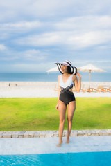 Portrait beautiful young asian women happy smile relax around swimming pool