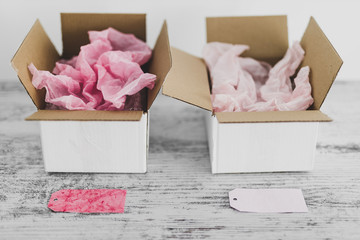 competition concept, delivery parcel boxes side by side with slightly different colors symbol of alternative products or brand competitors