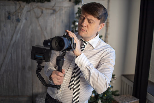The guy is shooting a film in the camera