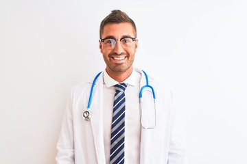 Young handsome doctor man wearing stethoscope over isolated background with a happy and cool smile on face. Lucky person.