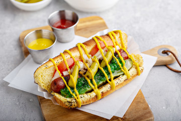 Fototapeta premium Chicago hot dog on a poppy seed bun topped with tomatoes and sweet relish