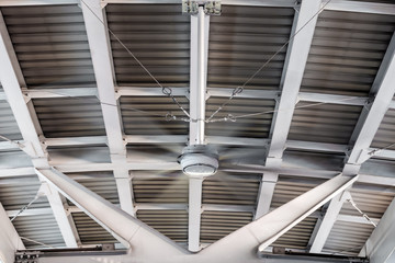 Ceiling construction and pattern with giant fan/ventilation system at the skytrain platform
