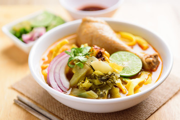 Northern Thai food (Khao Soi Kai), spicy egg noodles soup with chicken
