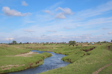 the river flows pond among the hills in the Siberian steppe in the spring