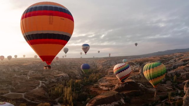 A balloon flies over Cappadocia, shooting from a drone in 4K