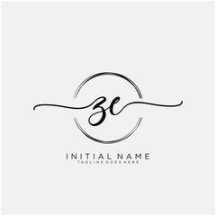ZE Initial handwriting logo with circle template vector.