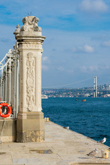 Dolmabahce Palace column and Bosphorus bridge. Istanbul, Turkey