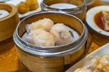 Steamed stuffed shrimp dumpling in dimsum bamboo steamer box