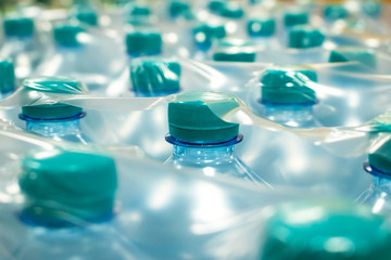 Water in plastic bottles.