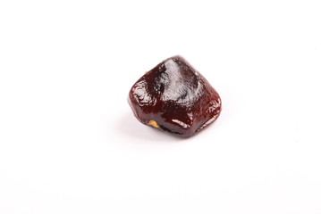 Image of tamarind seed on a white background.