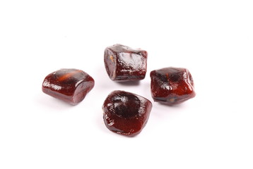Image of tamarind seeds on a white background.