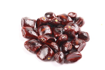 Image of tamarind seeds on a white background.
