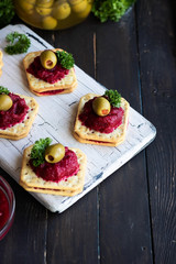 Beetroot relish on crackers. An original party snack.
