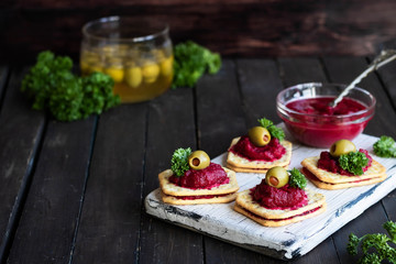 Beetroot relish on crackers. An original party snack.