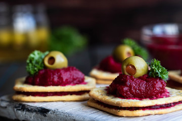Beetroot relish on crackers. An original party snack.