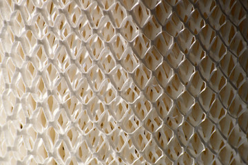 background texture of a paper hep of a diamond-shaped filter used to purify and moisten the air