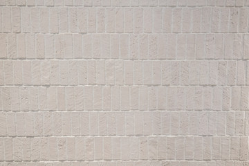 White vintage rough brick in vertical direction / background texture / interior design mateiral