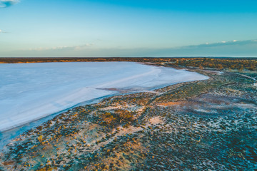 Salt lake in Australian desert at dawn - aerial view