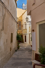 Fototapeta na wymiar Typical Streets Of Old City Gallipoli In Puglia Italy During a Bright Sunny Day