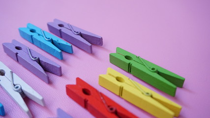 clothes pegs on blue background