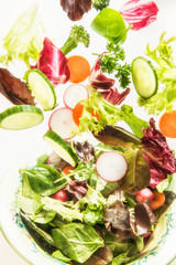 Tossed veggies on white background 