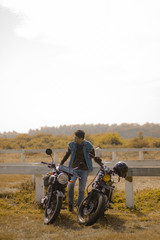 biker and the motorcycle on savanna