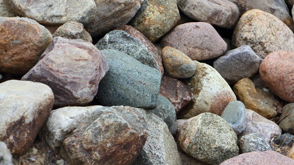 Beautiful textured dry gravel closeup on beach, wide natural background surface