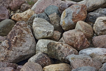 Fototapeta na wymiar Dry textured stone gravel closeup on beach, natural backdrop