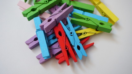 Fototapeta premium colorful shirt clips on a white background
