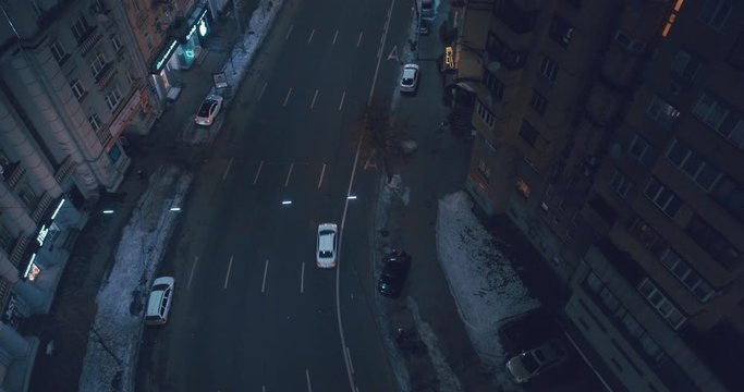 Top down aerial view of night streets in downtown Kyiv, Ukraine, with bright night lighting. Wide shot on dji mavic 2 pro hasselblad camera with smooth cinematic drone motion 