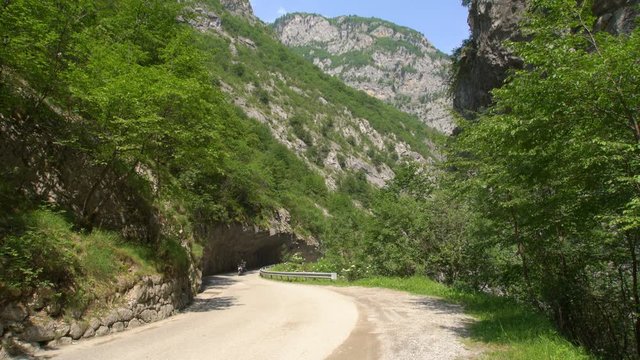 Rider at motorcycle trip green Rugova canyon lane road, Kosovo