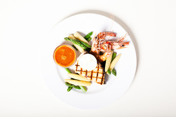 Grilled fish steak wit prawns and vegetables