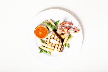 Grilled fish steak wit prawns and vegetables