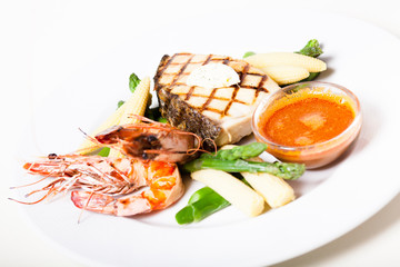 Grilled fish steak wit prawns and vegetables