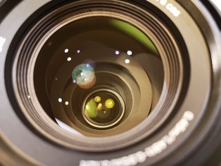 Aperture camera lens with reflective lens