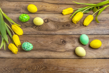 Easter yellow green eggs and tulips, copy space