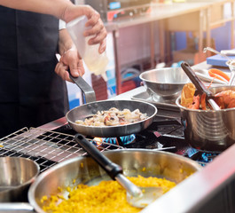 Chef preparing food in the kitchen, chef cooking, closeup