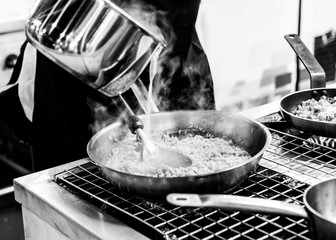 Chef preparing food in the kitchen, chef cooking, closeup