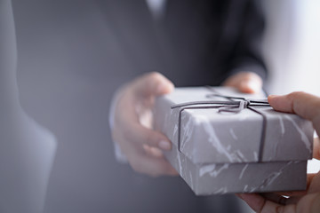 businessman with gift box on occasion of celebration