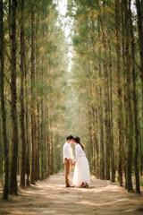 Young asian groom and bride posing and smiling for pre-wedding shot