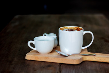 cup of coffee on wooden table