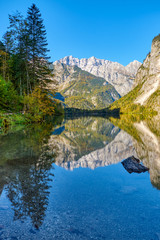 The beautiful Obersee in the Bavarian Alps with a reflection of the mountains in the water