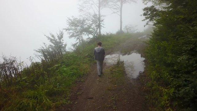 Walking in misty foggy mountain road of North Turkey