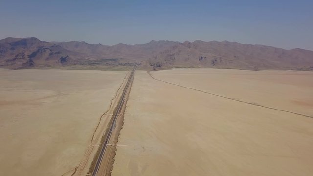Dusty highway on the oriental yellow desert in Iran