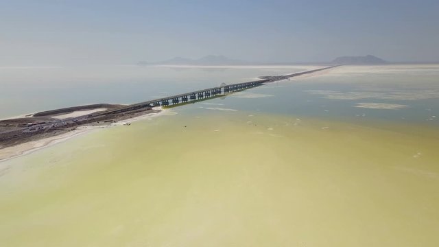 Long highway on the white Urmia salt lake in Iran